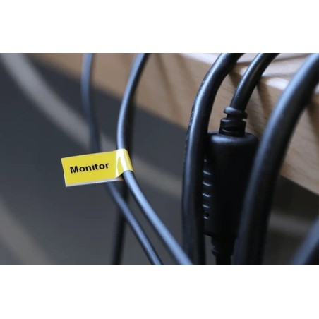 Cinta laminada flexible. Texto negro sobre fondo amarillo. 9mm (8mts de largo)